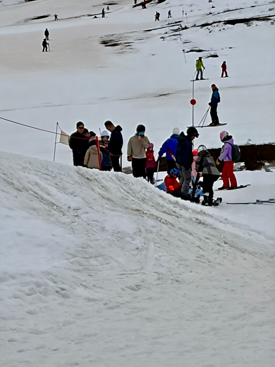 Skiers gathering for a beginner lesson on the mountain